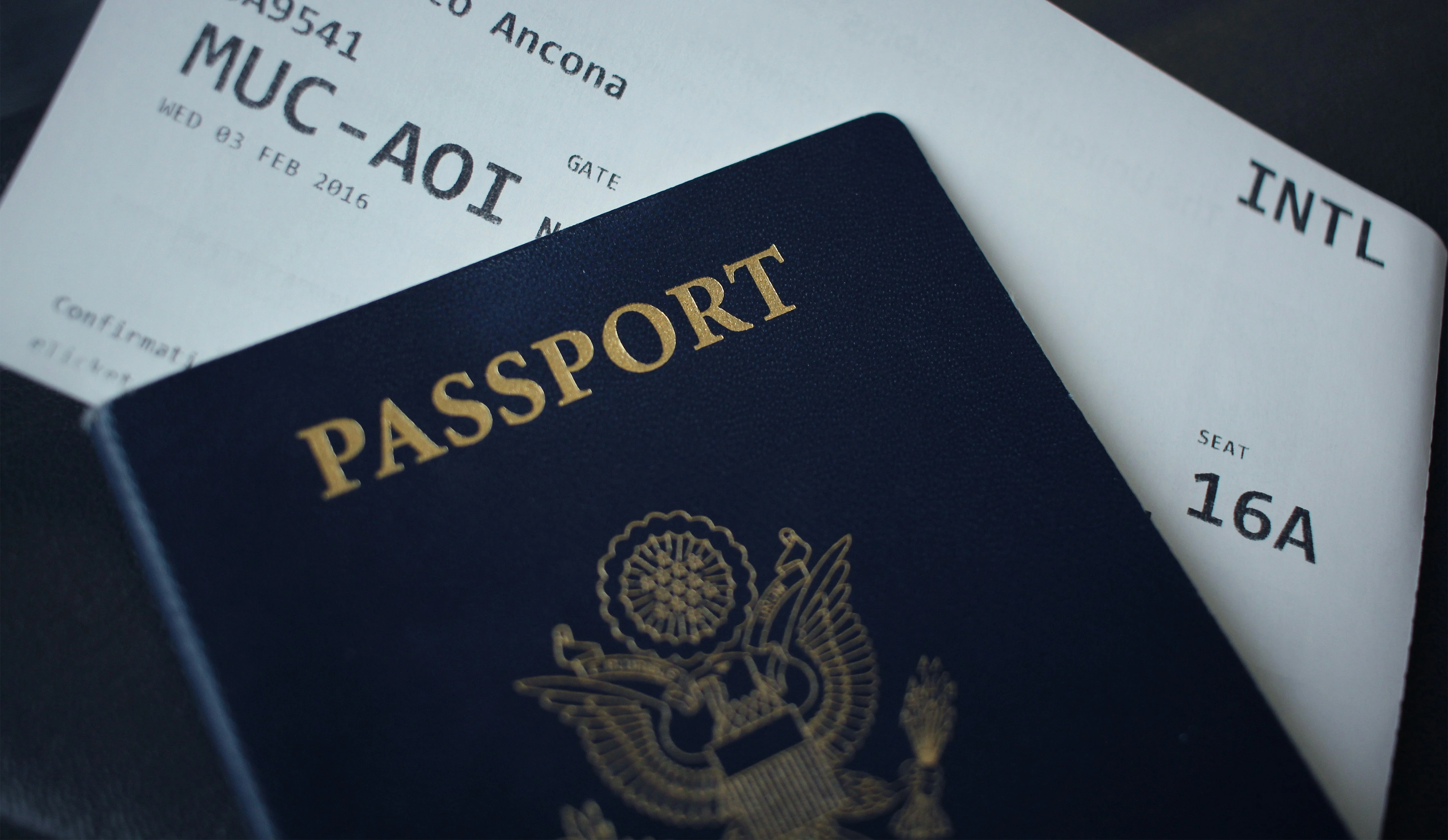Passport booklet resting on top of application paperwork